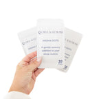 Hand holding Somny Aroma Dot - applying scent therapy to sleep mask Australia
